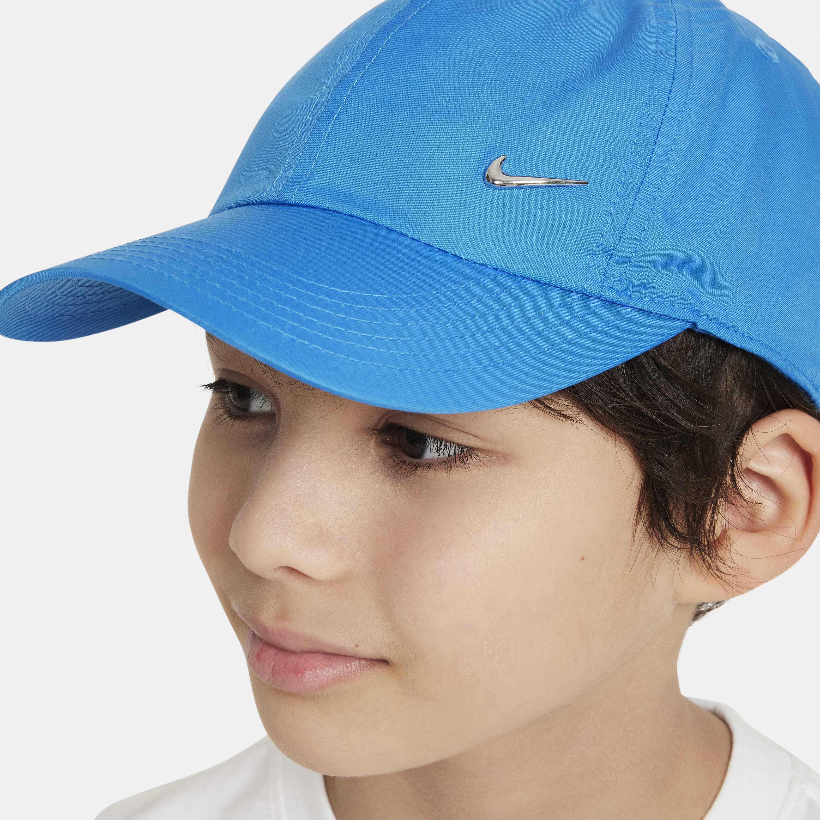 Nike metal swoosh cap blue top