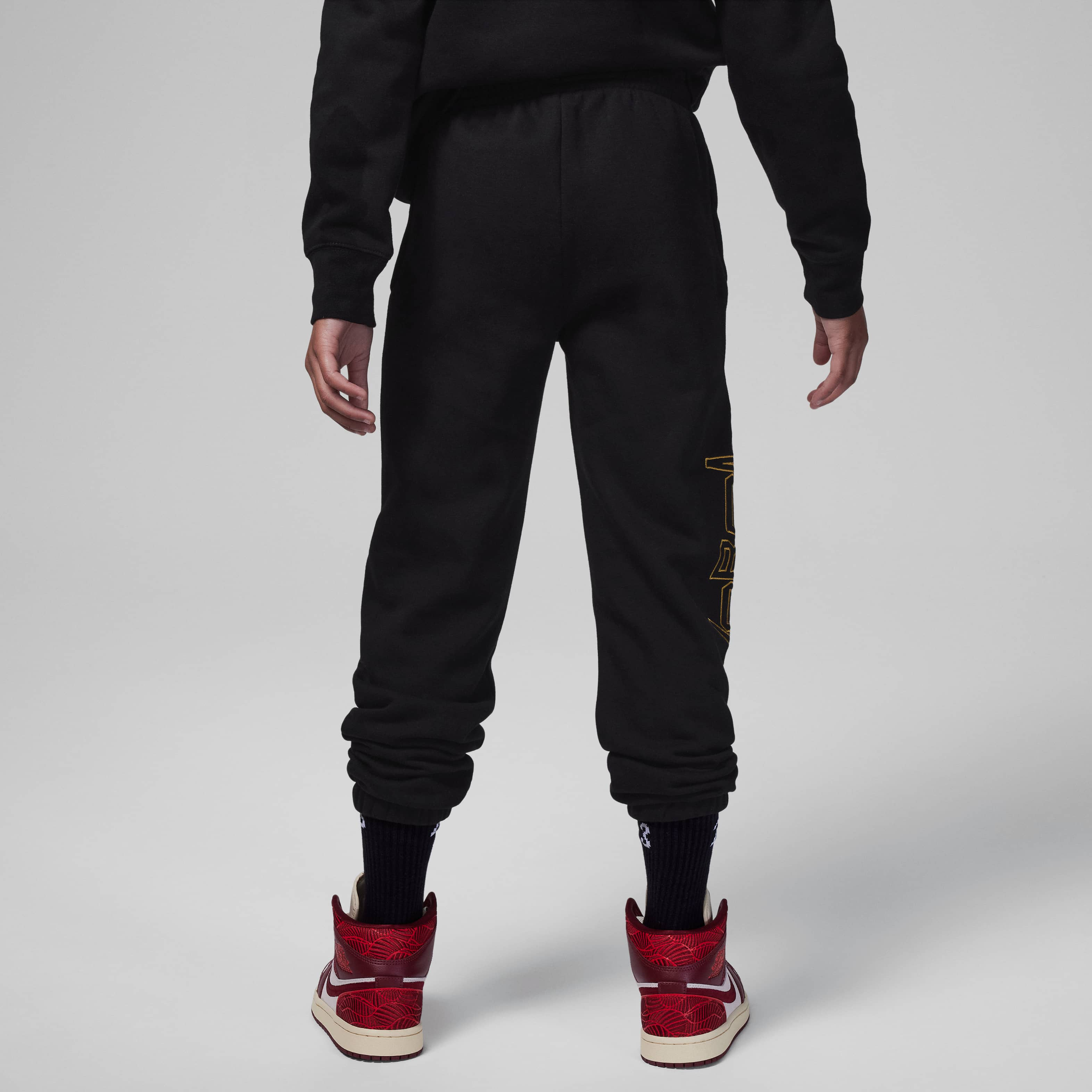 Jordan Take Flight Black and Gold Fleece Trousers image number 1