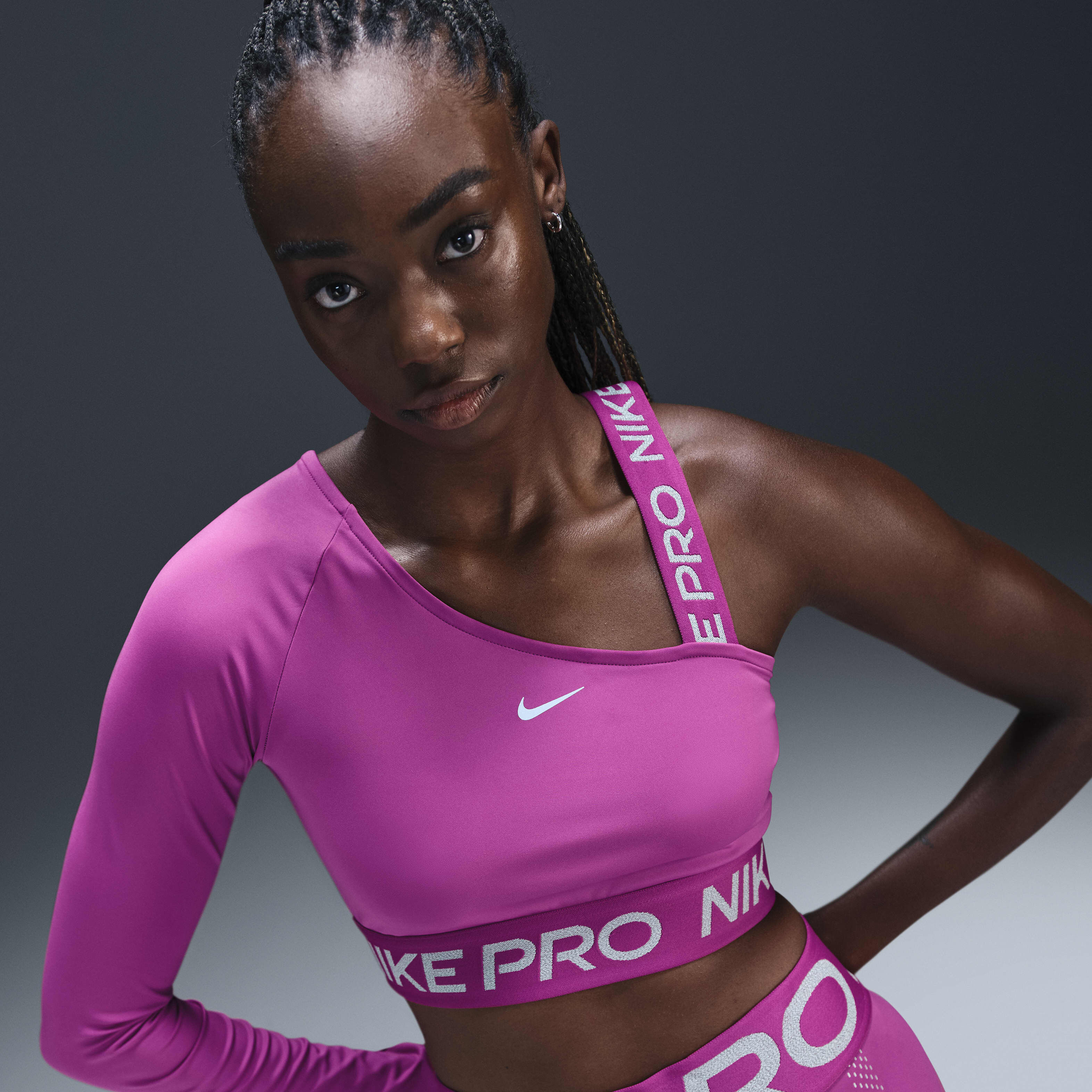 Buy Nike Pro Shine Women s Dri FIT Asymmetrical Cropped Top Nike Qatar Official