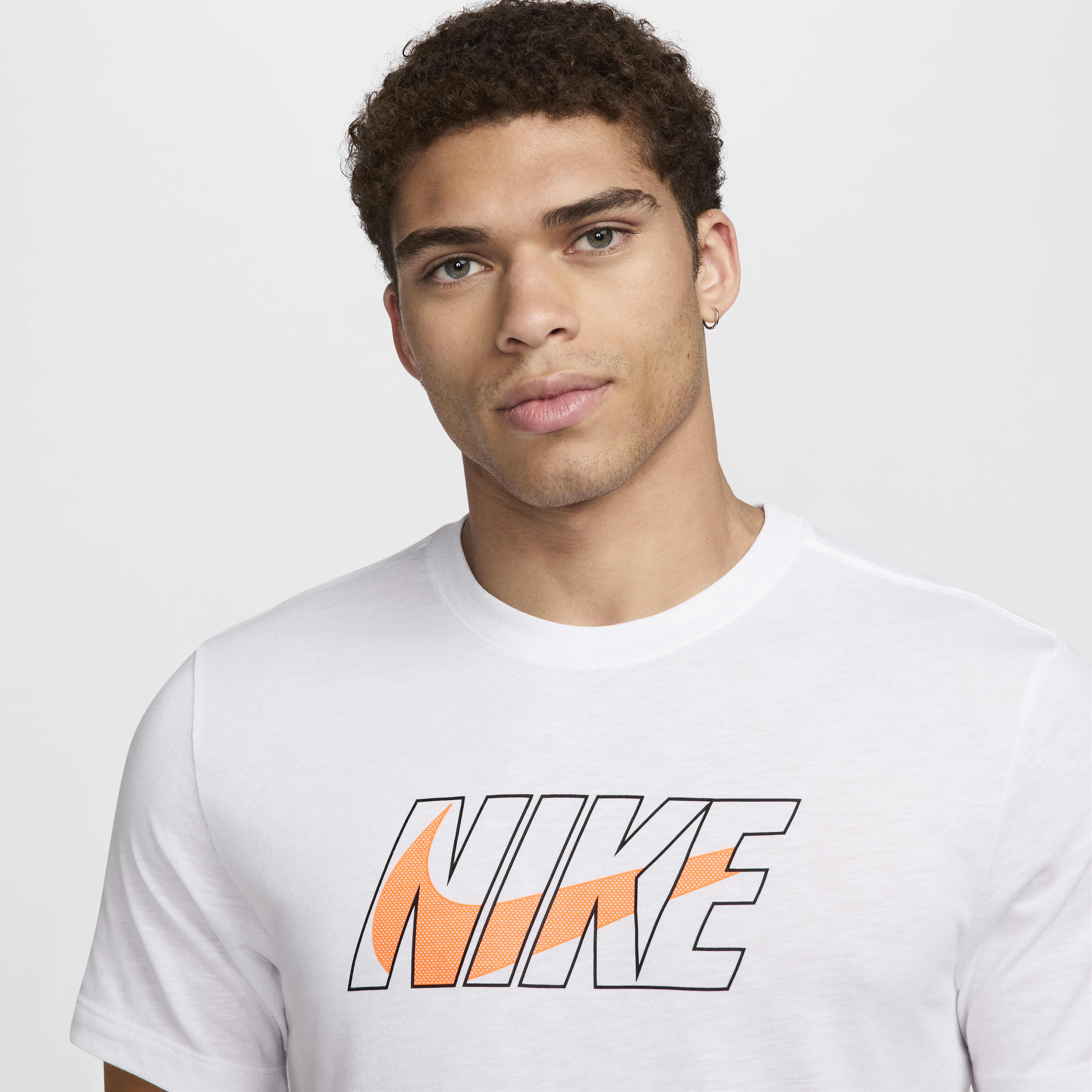 white nike shirt with orange logo