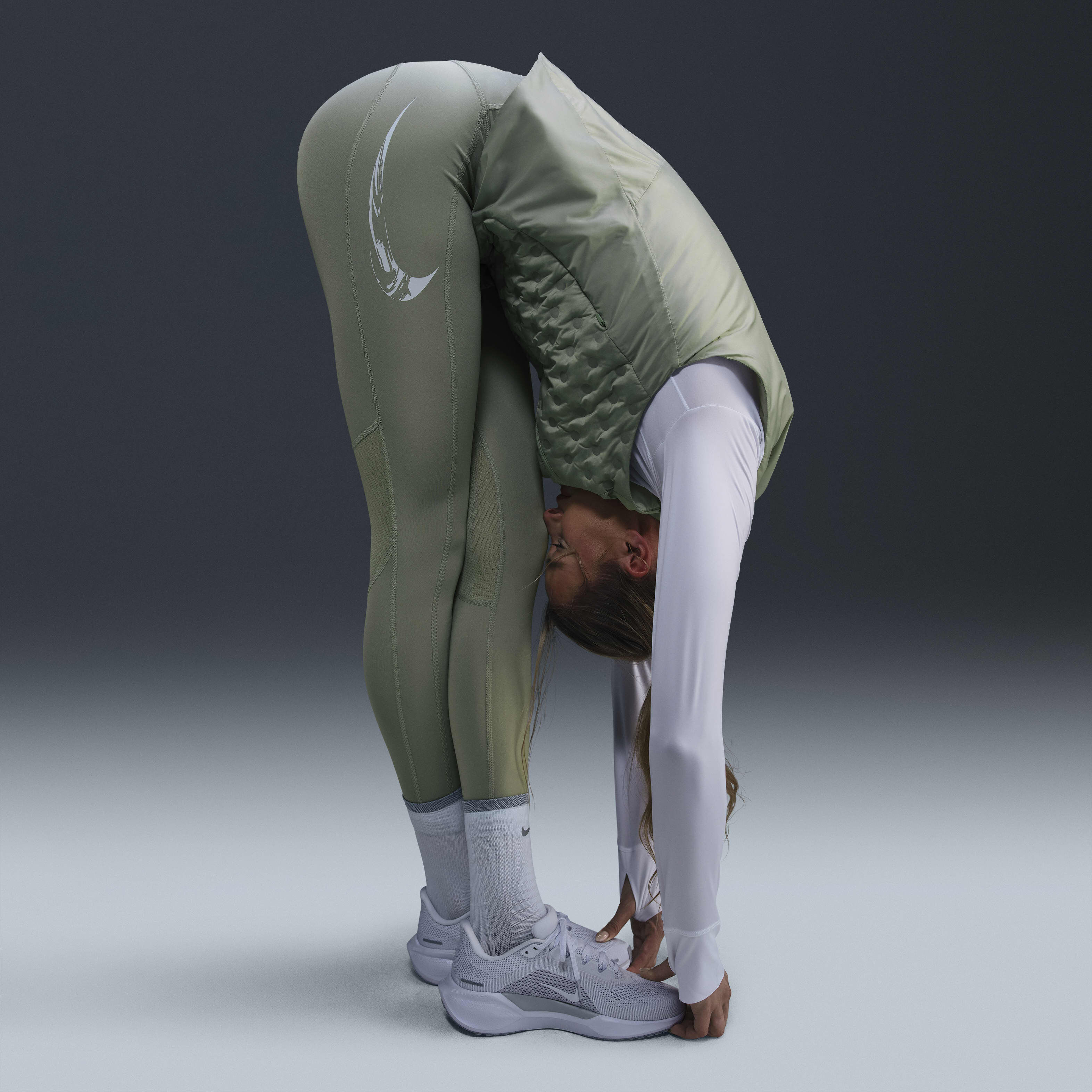 Buy Nike Fast Women s Mid Rise 7 8 Running Leggings with Pockets Nike Qatar Official