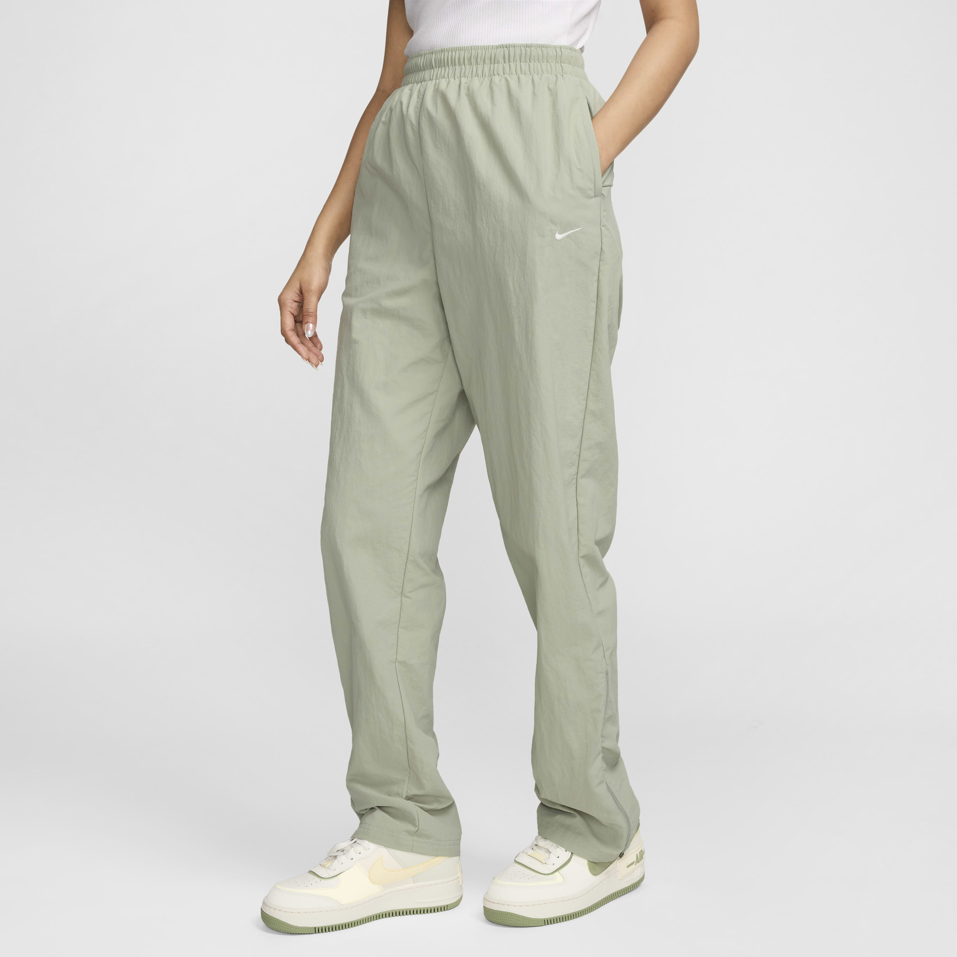 Buy Nike Sportswear Essential Women s UV High Waisted Open Hem Zip Trousers Nike Qatar Official