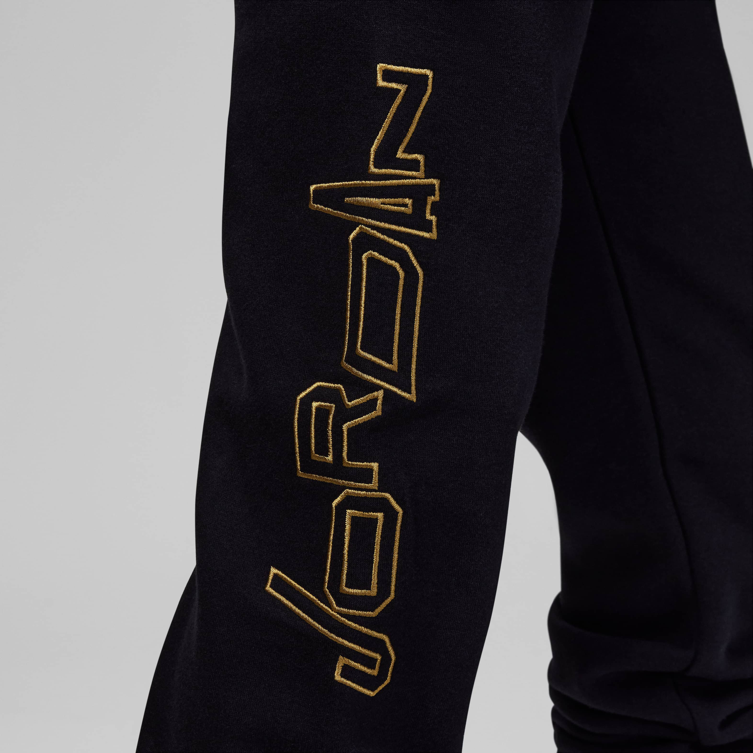 Jordan Take Flight Black and Gold Fleece Trousers image number 4