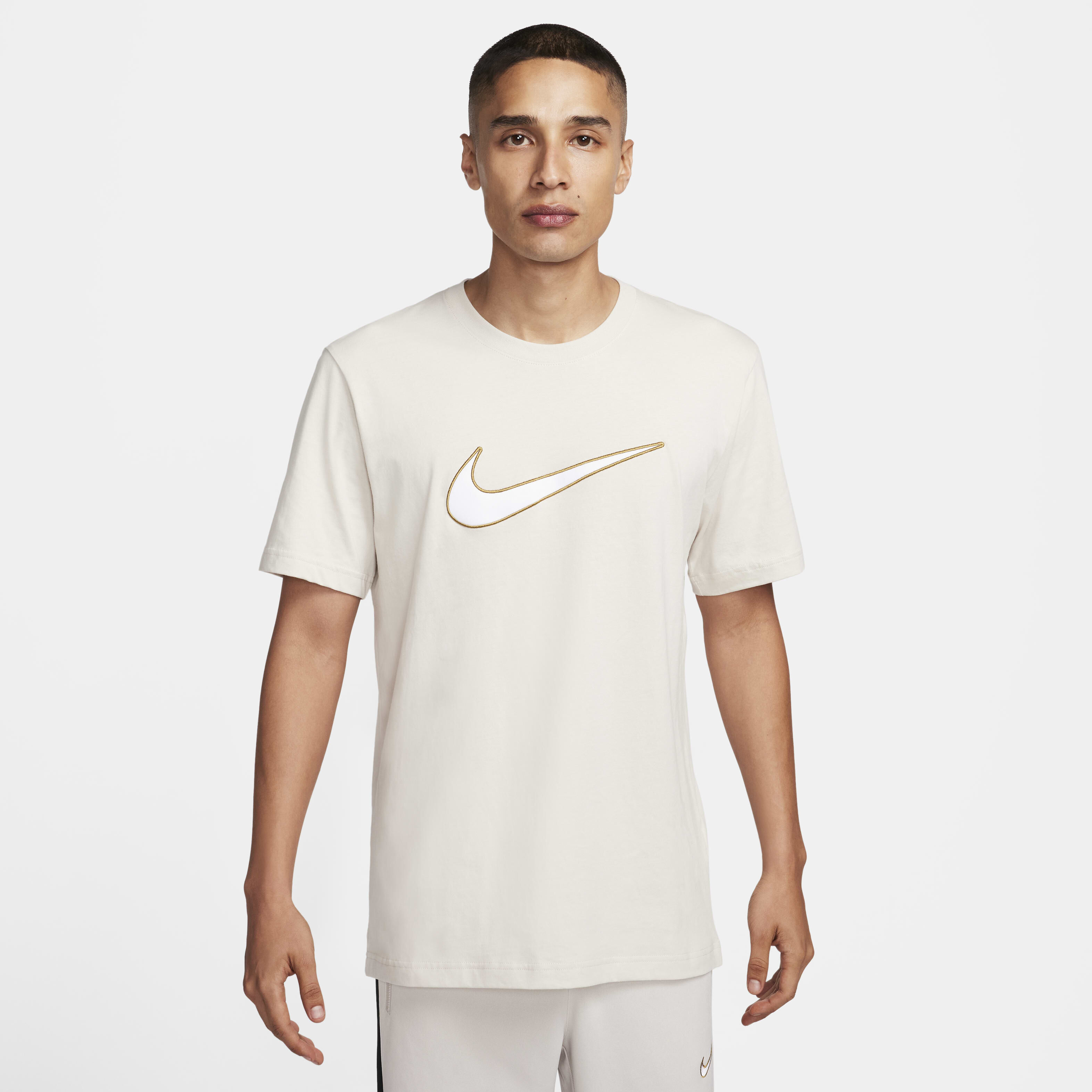white and brown nike shirt