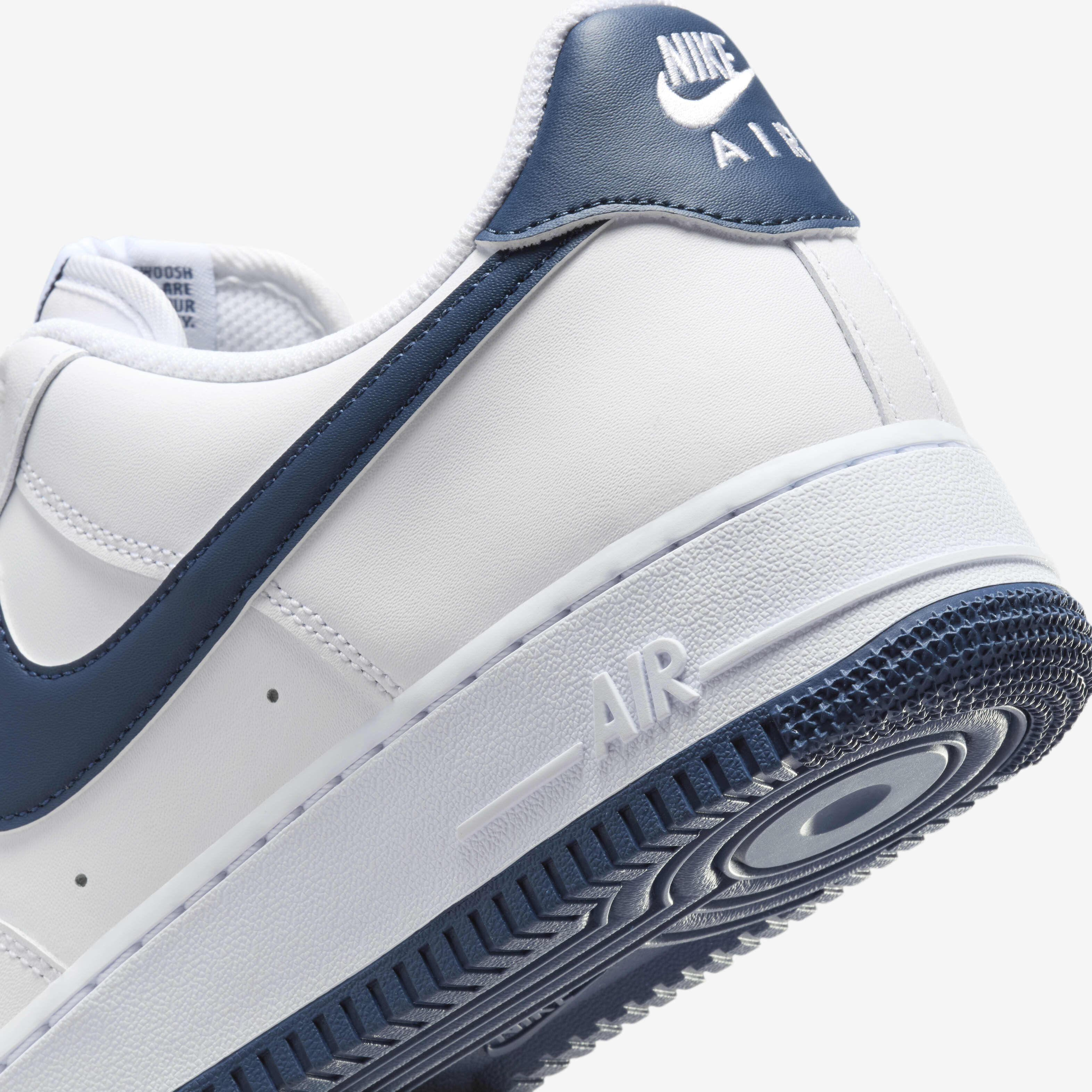 navy and white nike shoes