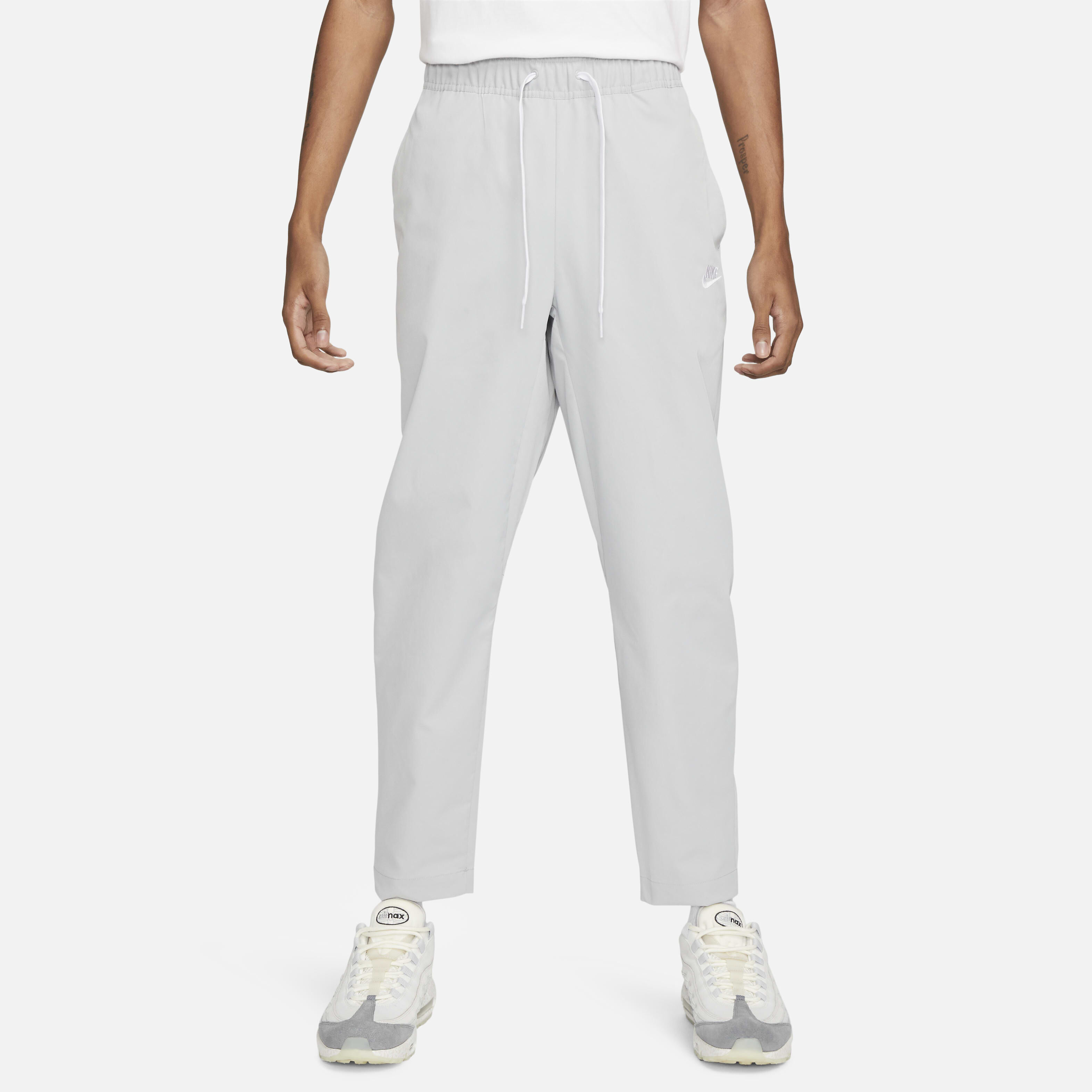 Nike woven tapered pants hot sale