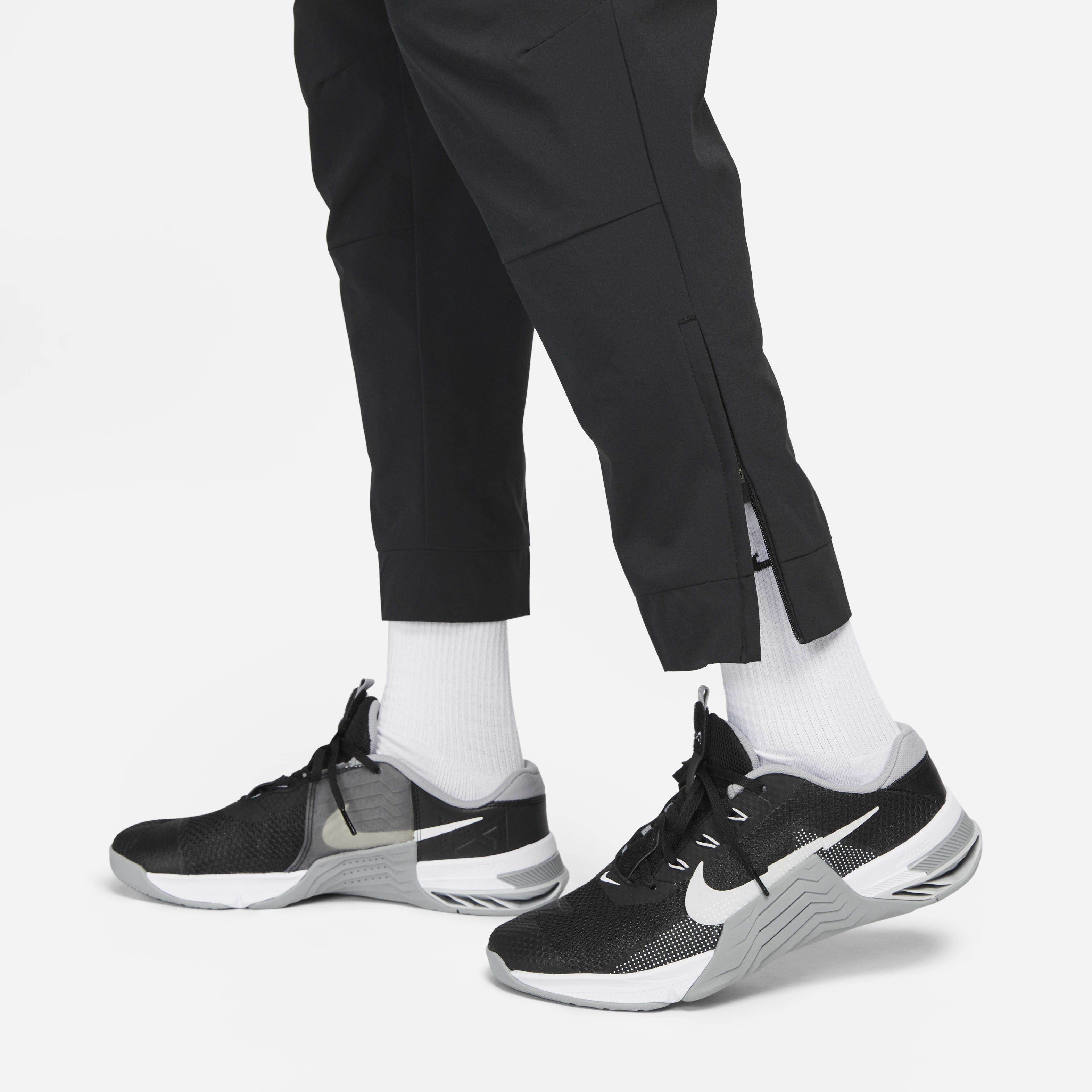 Buy Nike Unlimited Men s Dri FIT Zip Cuff Versatile Trousers Nike Qatar Official