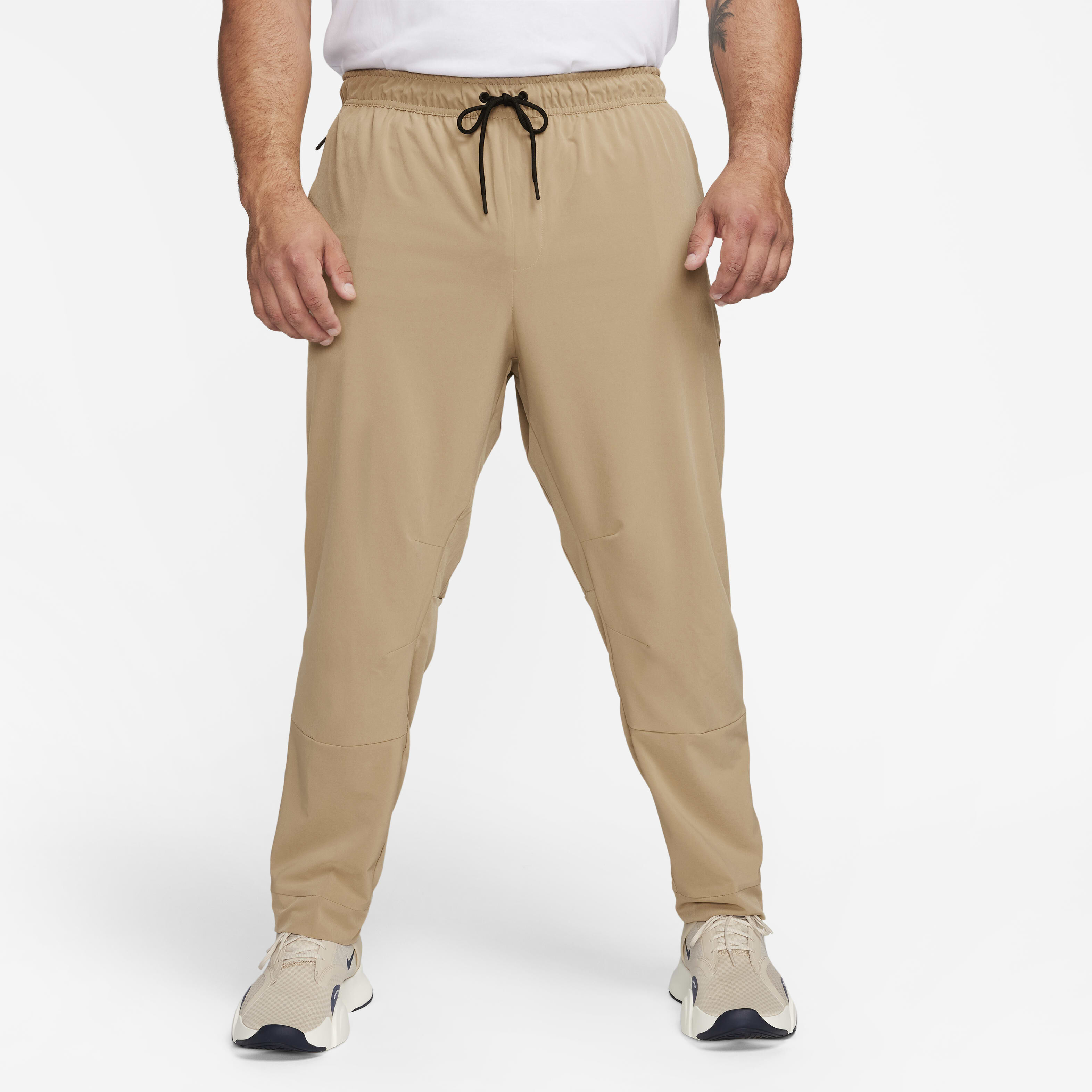 Buy Nike Unlimited Men s Dri FIT Zip Cuff Versatile Trousers Nike Qatar Official